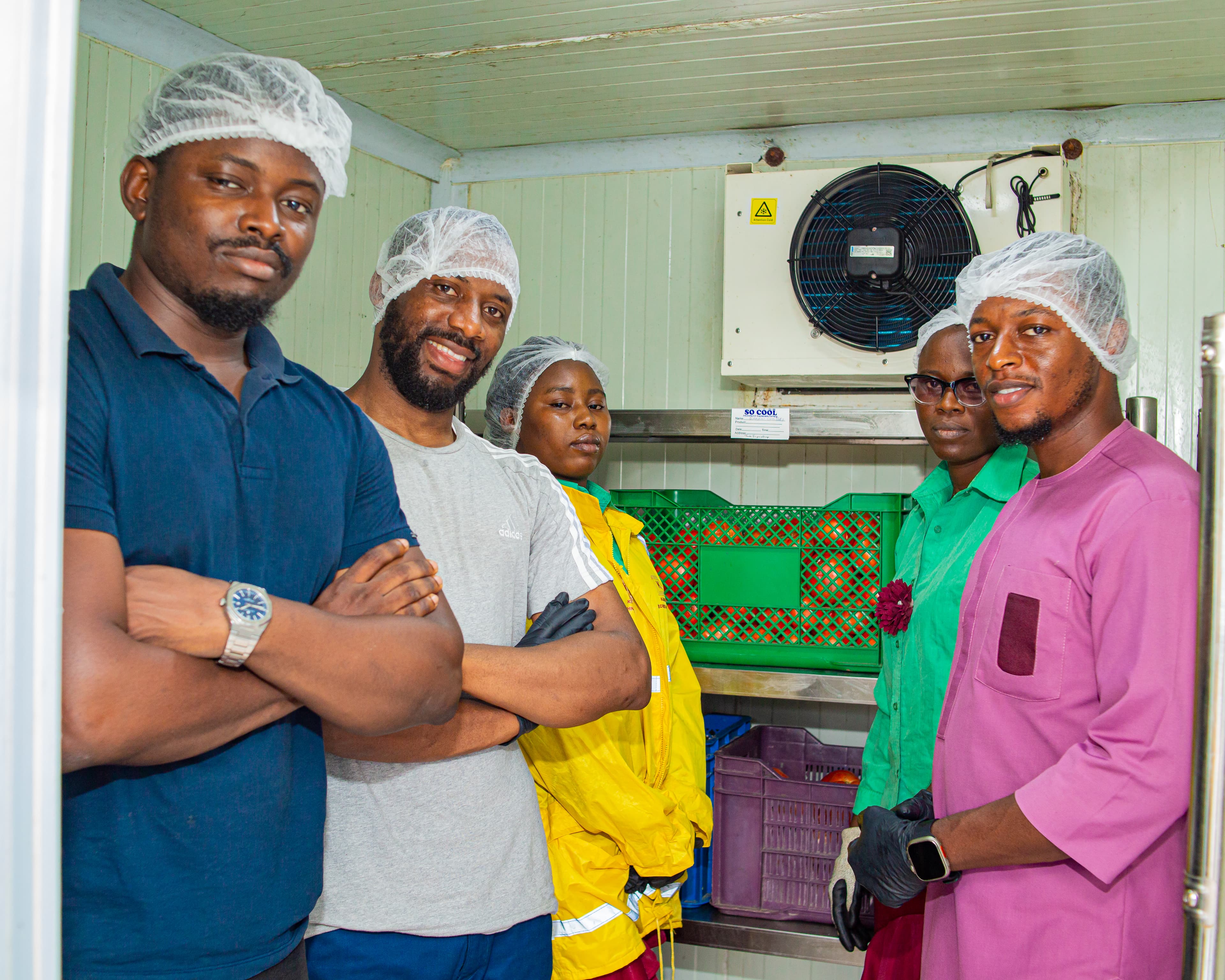 Farmers working together in a HARVIST cold-storage facility.